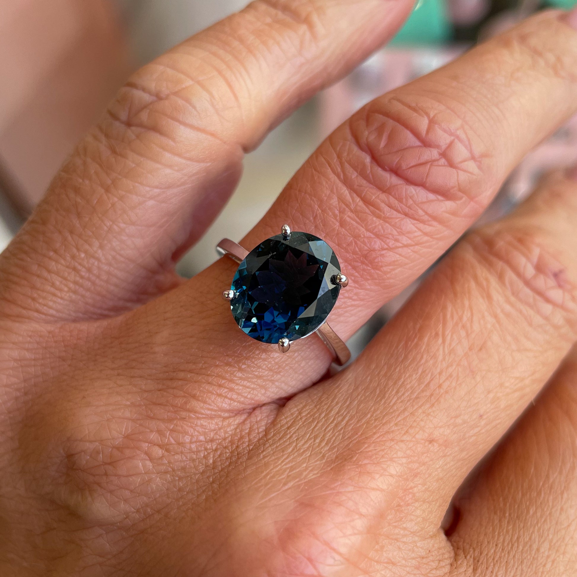 Herbert 9ct white gold oval cut London Blue Topaz ring displayed on a white background.