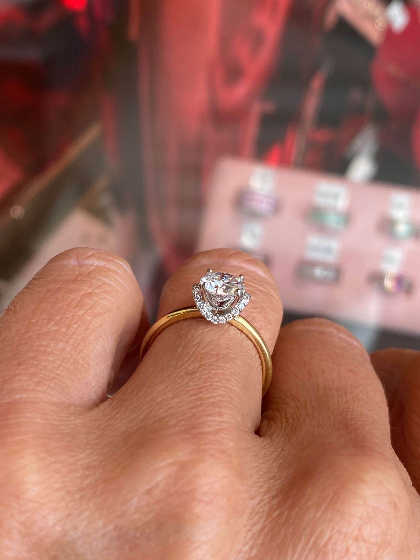 Domino 18ct gold chevron halo solitaire engagement ring with 1.01ct certified lab-grown diamond and intricate design.