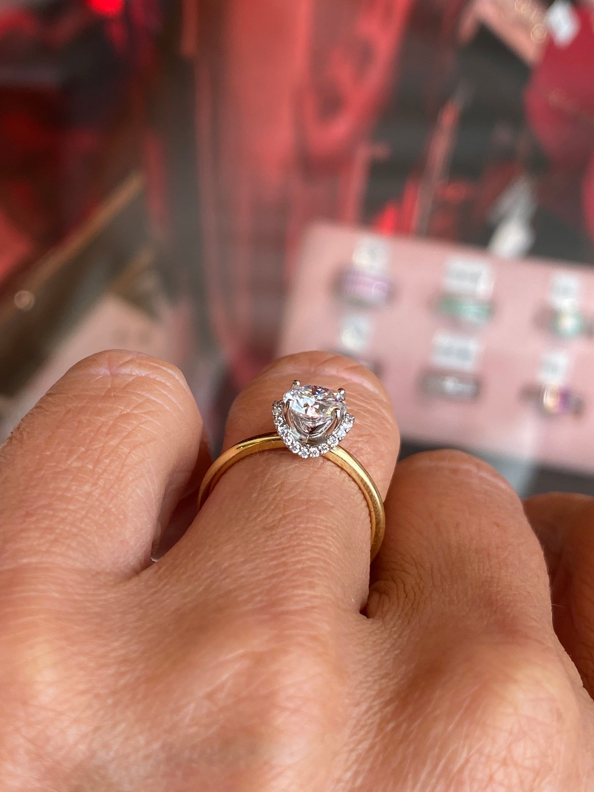Domino 18ct gold chevron halo solitaire engagement ring with 1.01ct certified lab-grown diamond and intricate design.