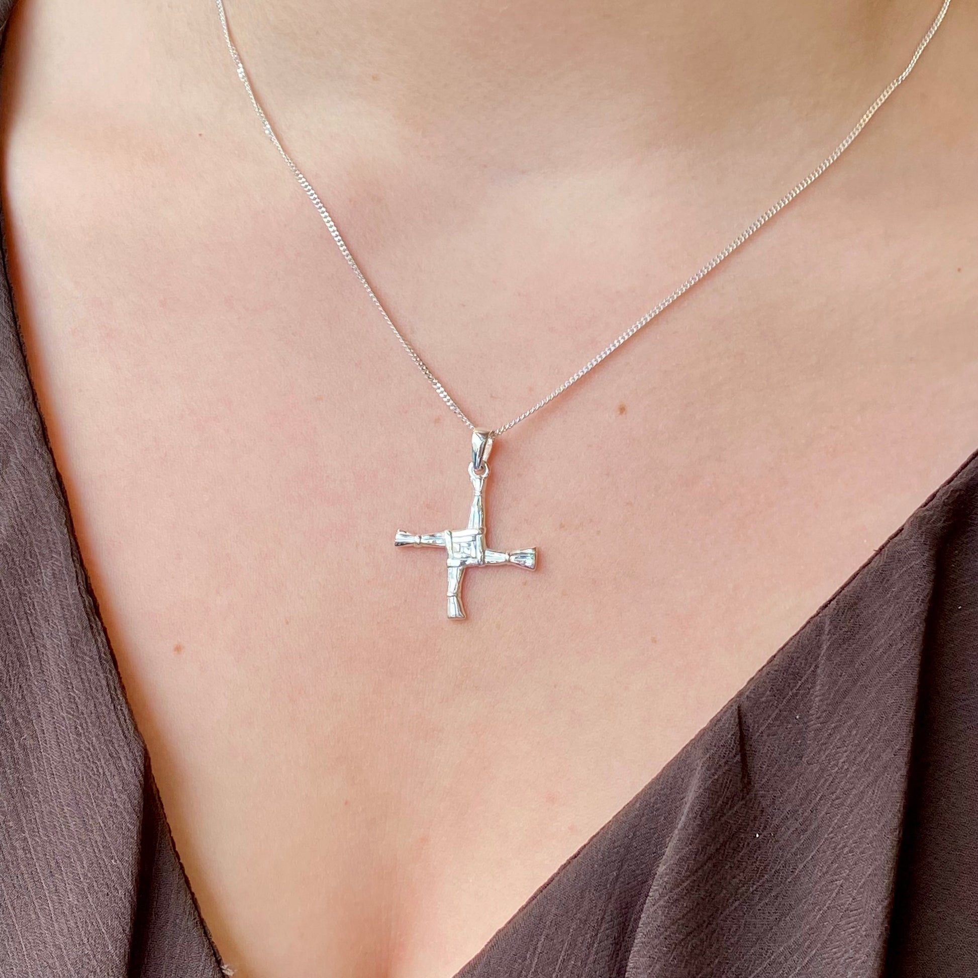 Medium silver St Bridget cross necklace by Clandela, showcasing intricate detailing and a polished finish.