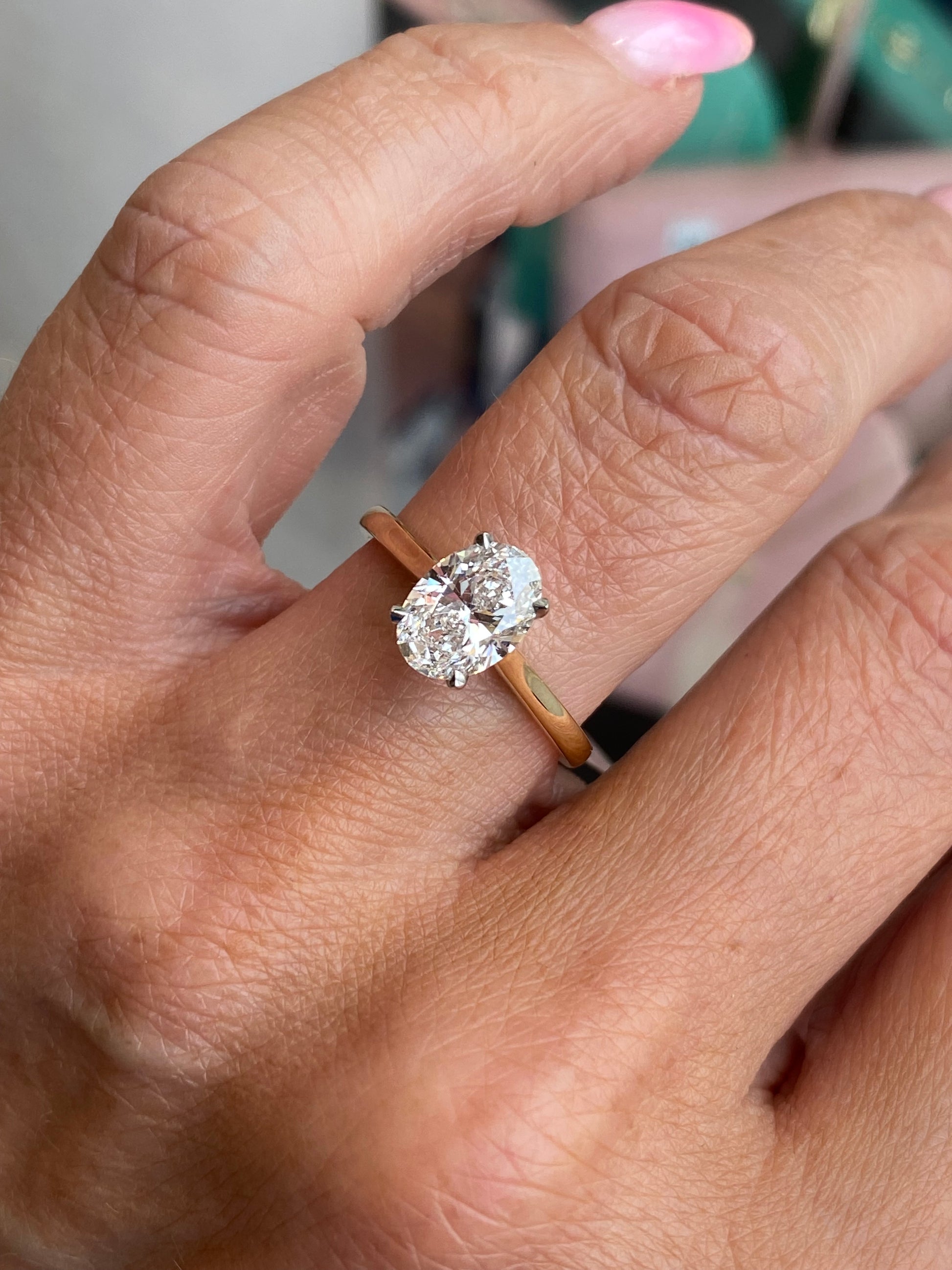 18ct gold oval solitaire engagement ring with a 1.51ct certified lab diamond, featuring a sleek and elegant design by Domino.