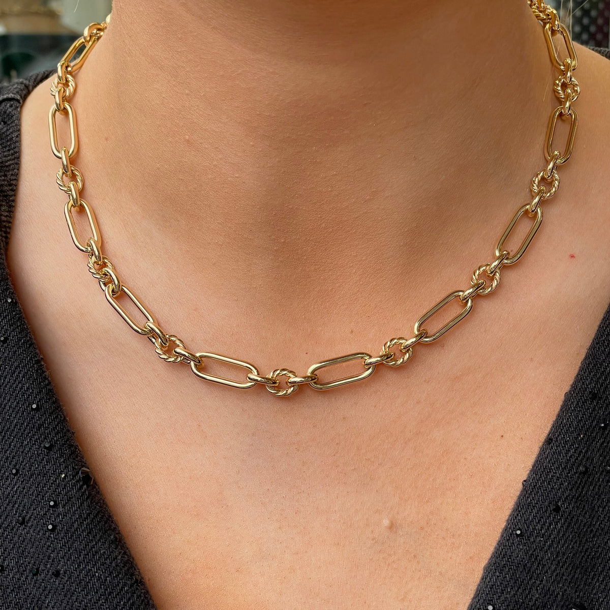 9ct gold long twist link necklace by Mark Milton featuring interlocking twisted chain links on a white background.