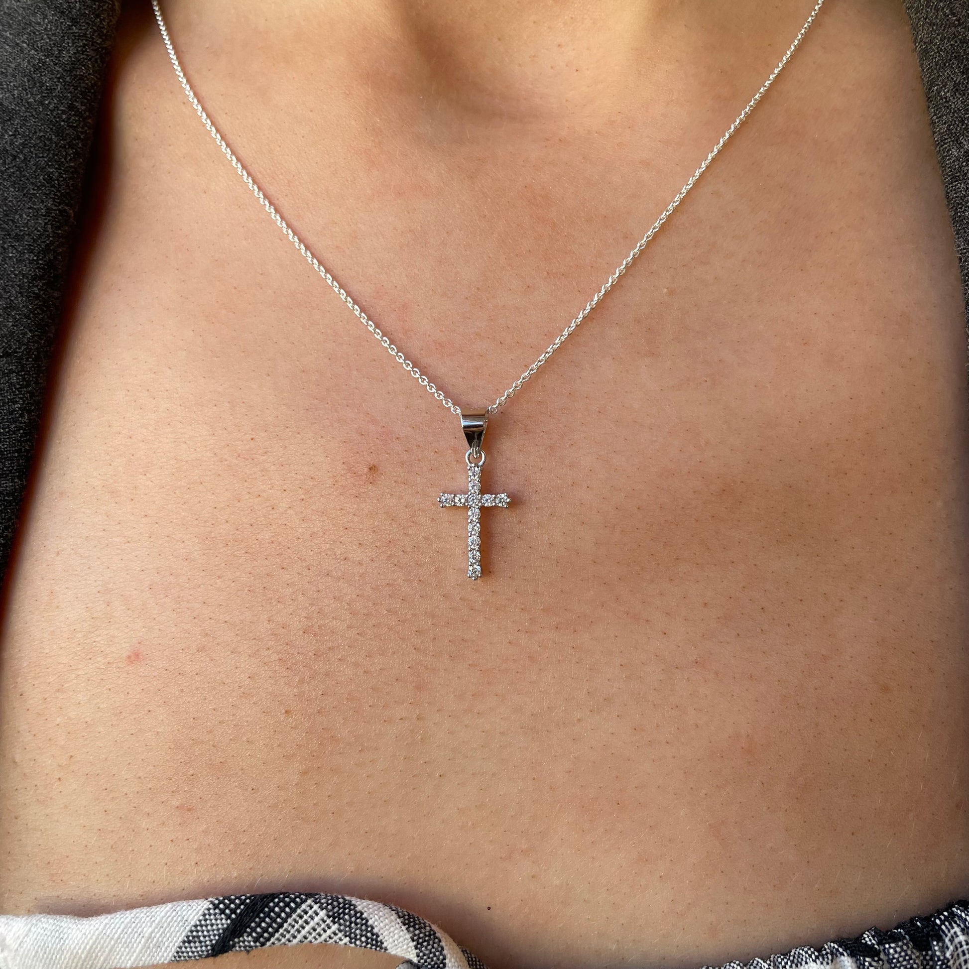 Silver CZ Cross Necklace from Comero, 18-inch chain featuring a sparkling cross pendant with cubic zirconia stones.