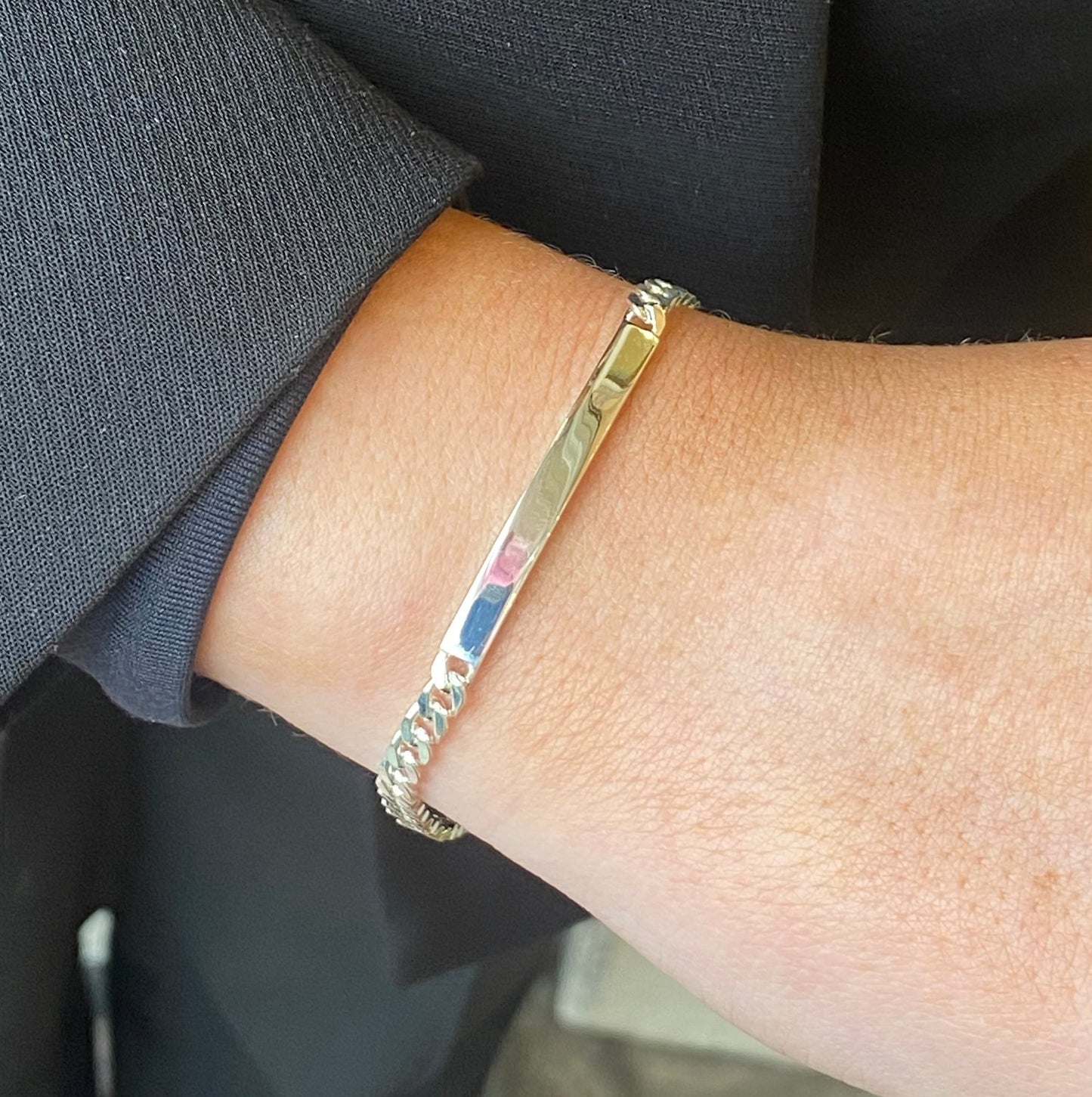Silver Insignia identity bracelet, 19cm, featuring engraved details and a sleek design, shown on a plain background.