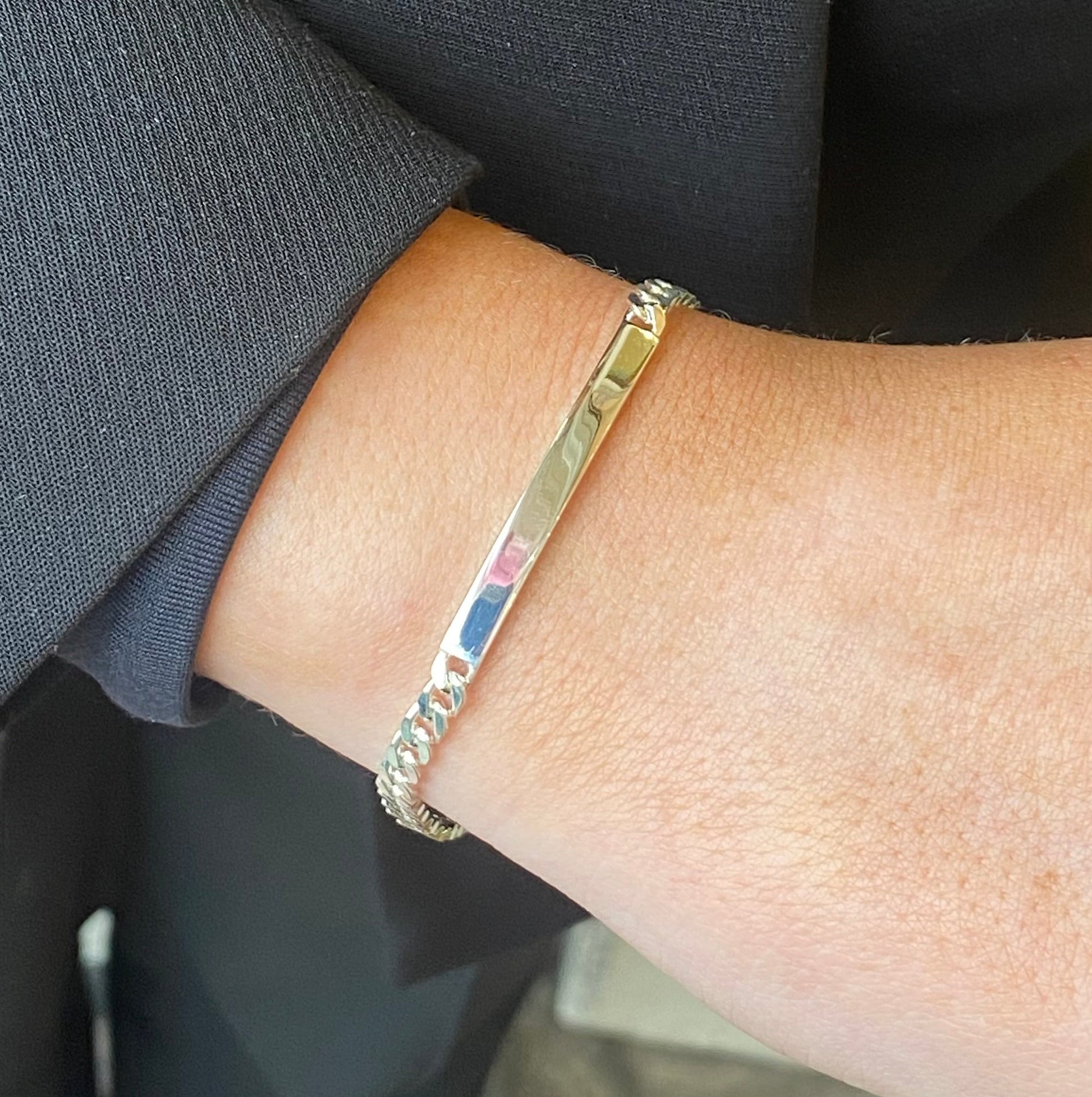 Silver Insignia identity bracelet, 19cm, featuring engraved details and a sleek design, shown on a plain background.