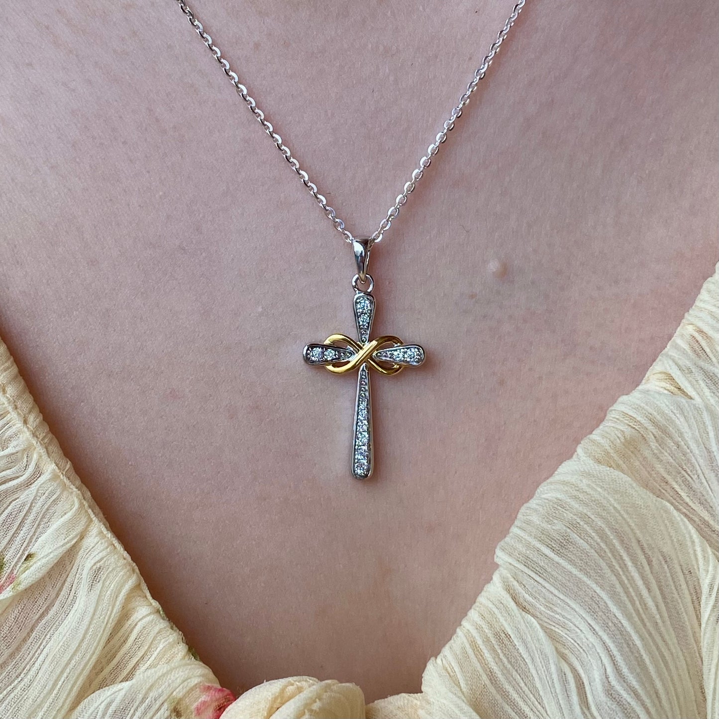 Silver CZ Infinity Cross Necklace by THC featuring a two-tone design with sparkling cubic zirconia accents.