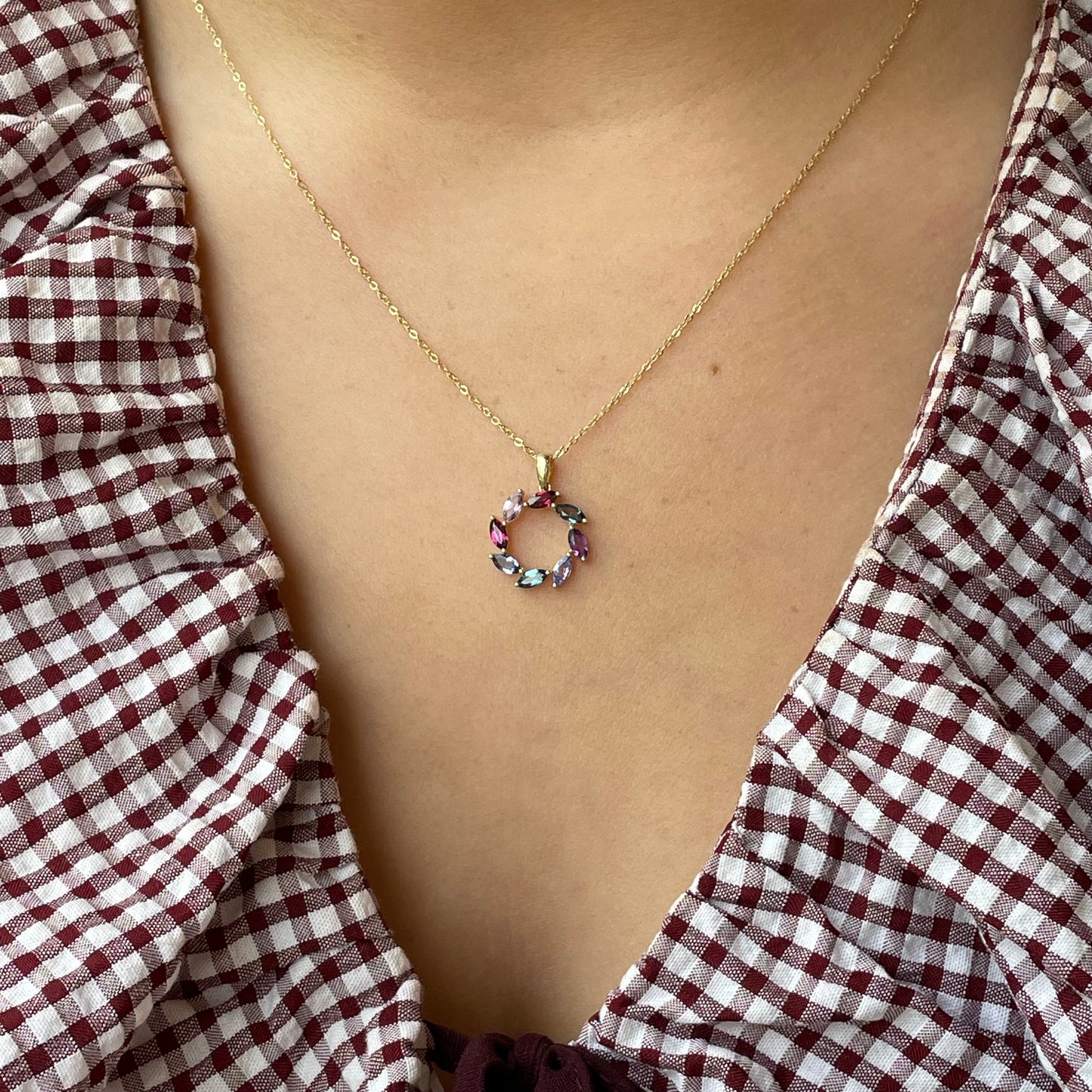 9ct gold multi-gemstone eternity necklace featuring colorful gemstones on a delicate chain by Mark Milton.