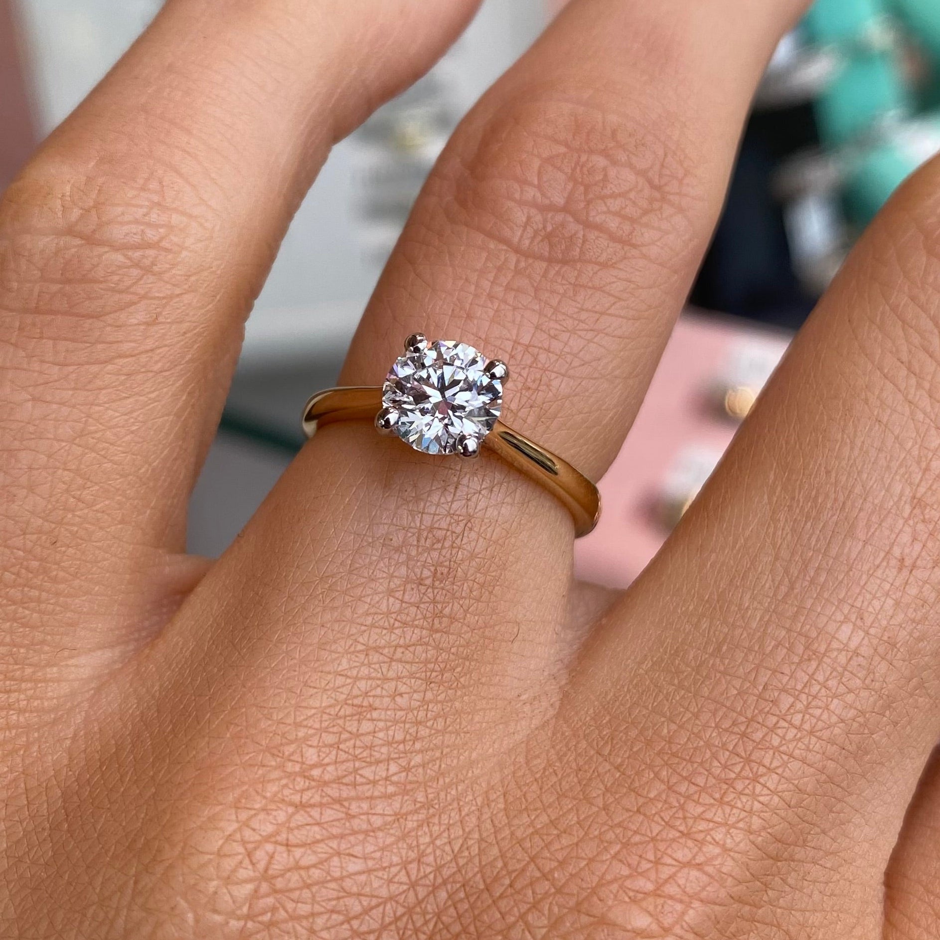 18ct gold solitaire engagement ring by Prima featuring a 1.01ct certified diamond with a sleek, classic design and polished finish.