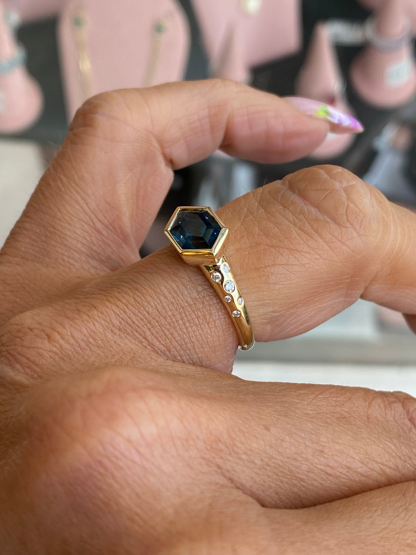 9ct gold London Blue Topaz and diamond ring by TCA featuring a vibrant blue topaz gemstone and sparkling diamonds set in gold.
