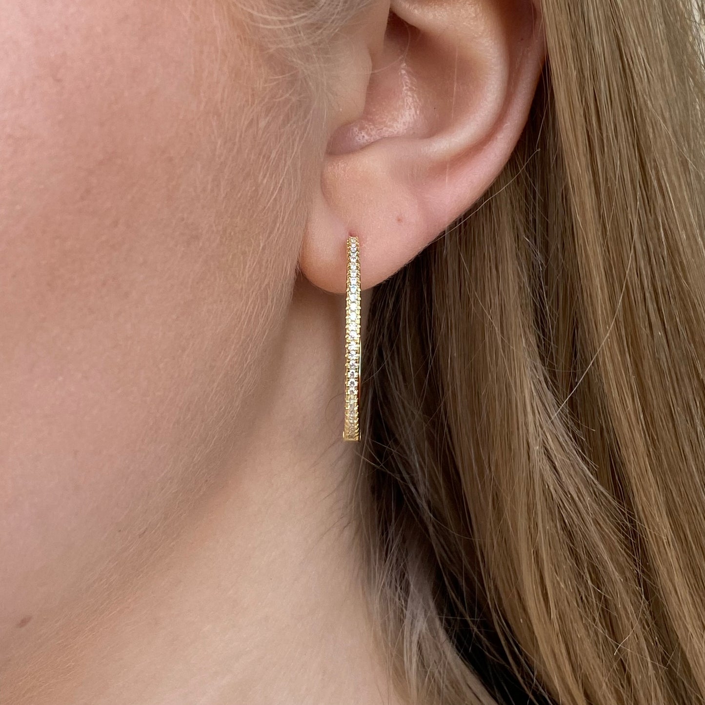 Sunshine Skinny CZ Hoop Earrings by Comero, 30mm diameter, gold-tone with sparkling cubic zirconia accents.