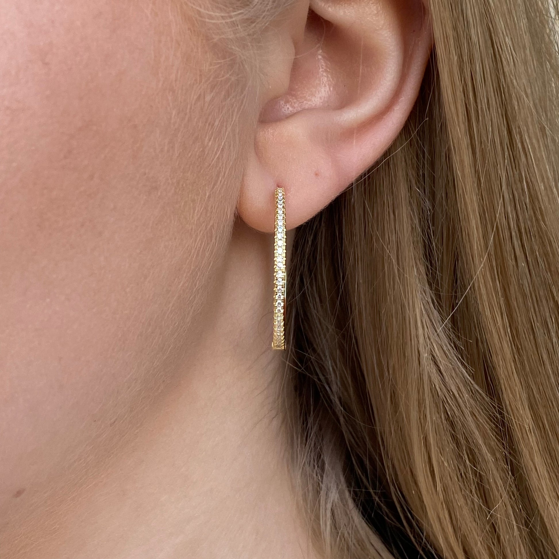 Sunshine Skinny CZ Hoop Earrings by Comero, 30mm diameter, gold-tone with sparkling cubic zirconia accents.