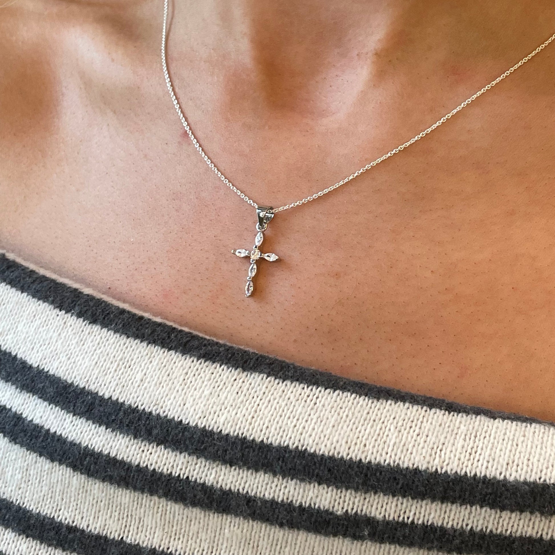 Silver CZ cross necklace from Comero with 18-inch chain, featuring a sparkling cross pendant visible in the image.