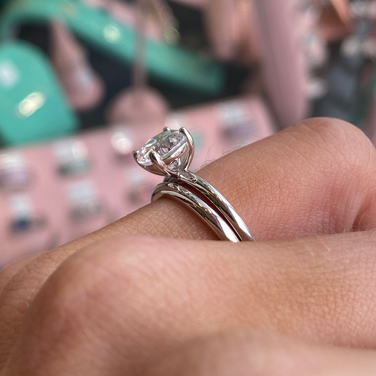 Silver CZ bridal ring set by THC featuring sparkling cubic zirconia stones and intricate band details.