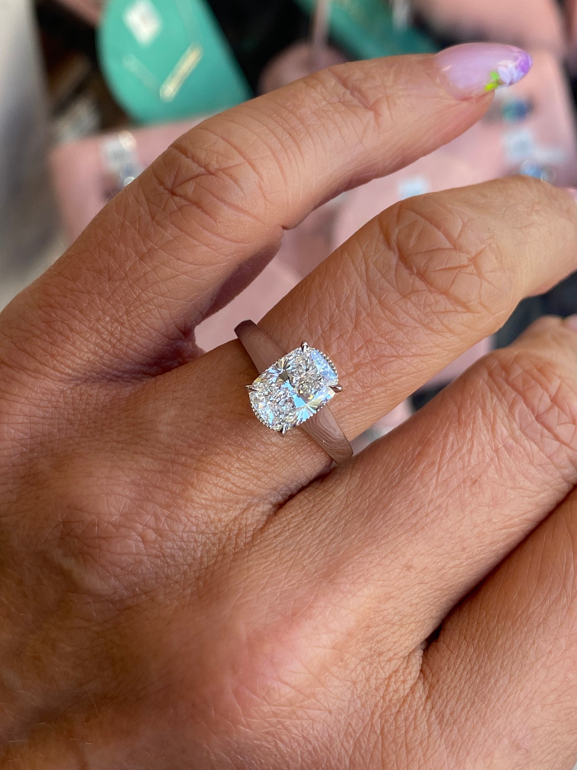 Domino platinum modified cushion solitaire engagement ring with 2.01ct lab certification, featuring a sparkling central diamond.