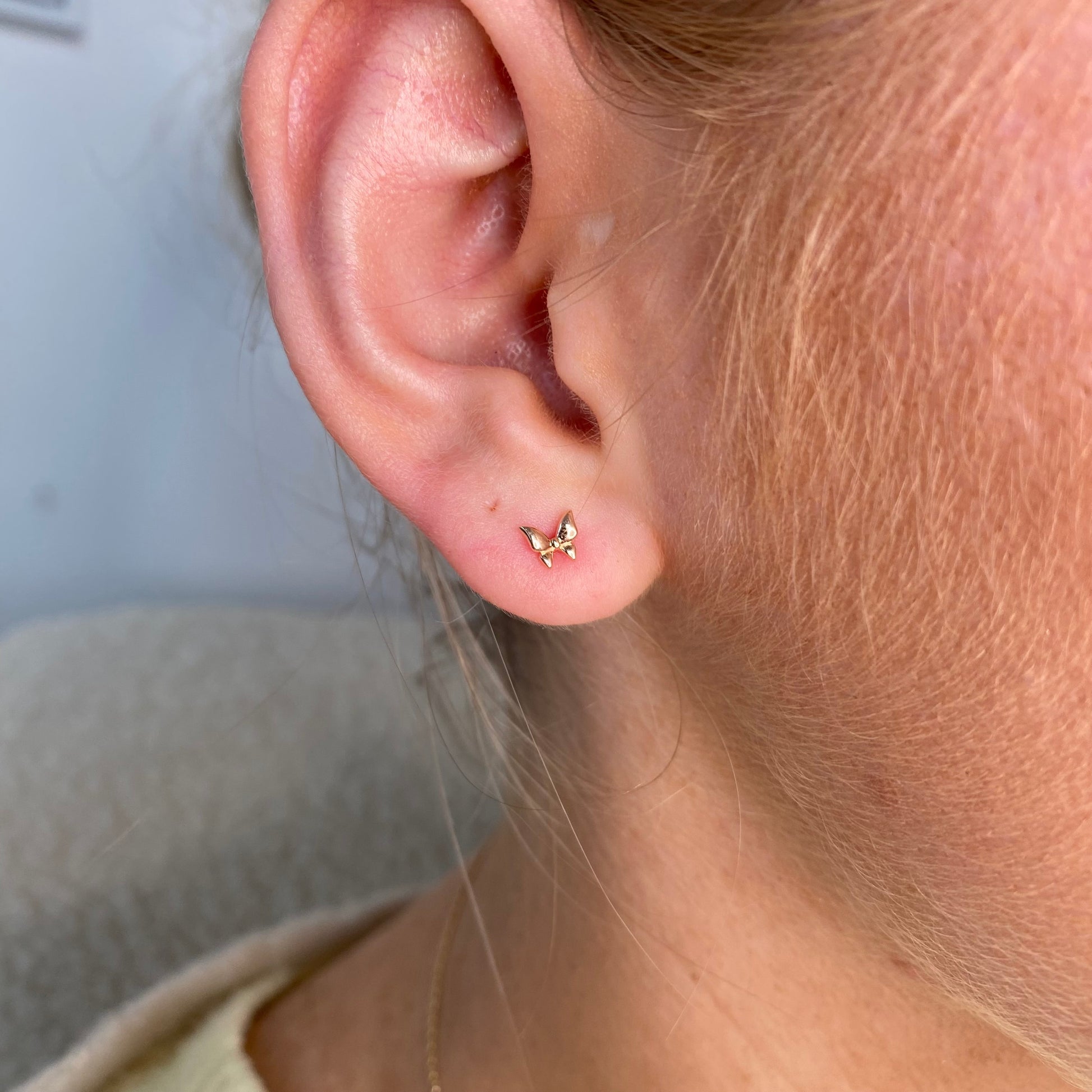 Kid's Sunshine Butterfly Stud Earrings by Comero featuring bright yellow butterfly design in silver-tone metal.