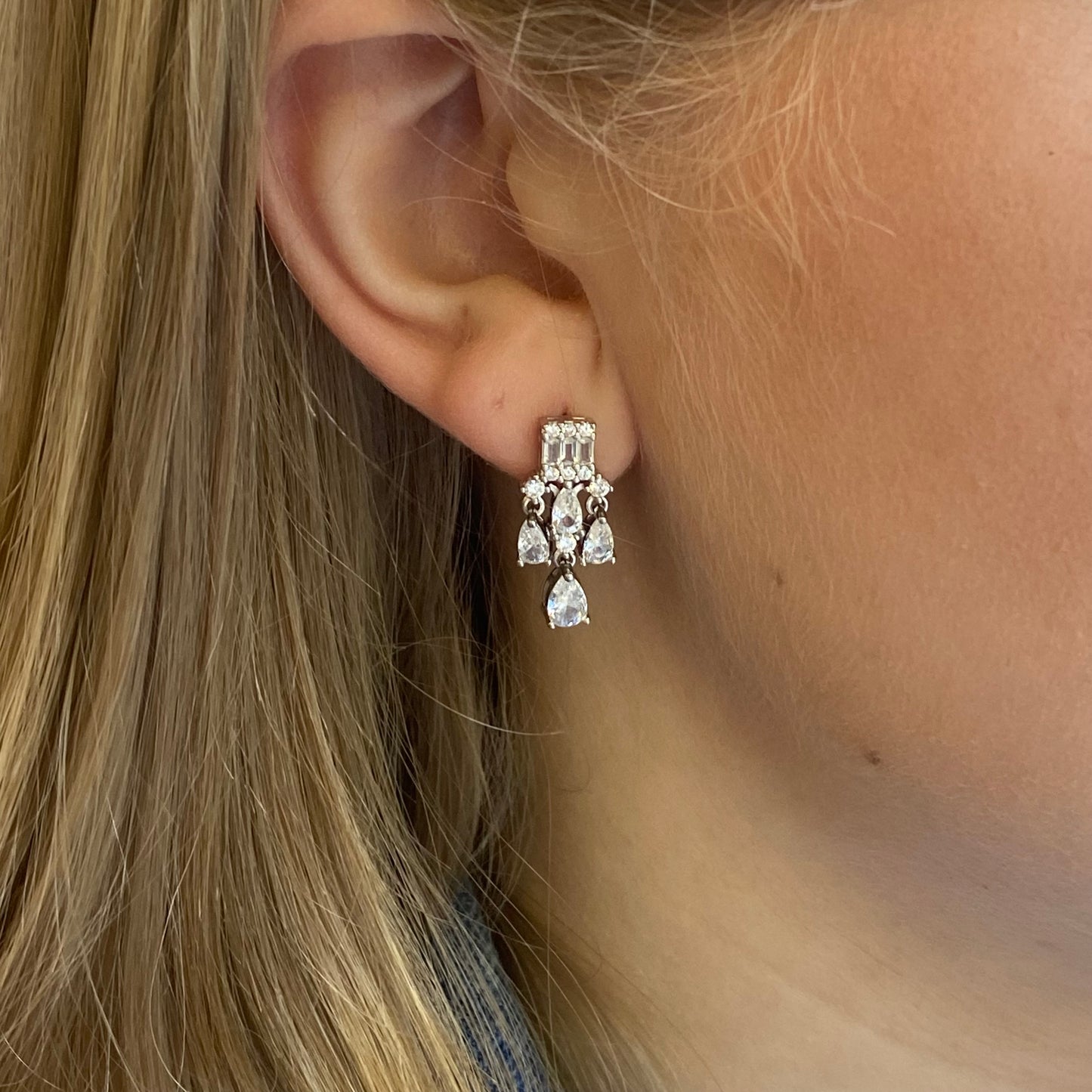 Silver Minerva Drop Earrings by Comero featuring elegant, handcrafted silver earrings with intricate design details.