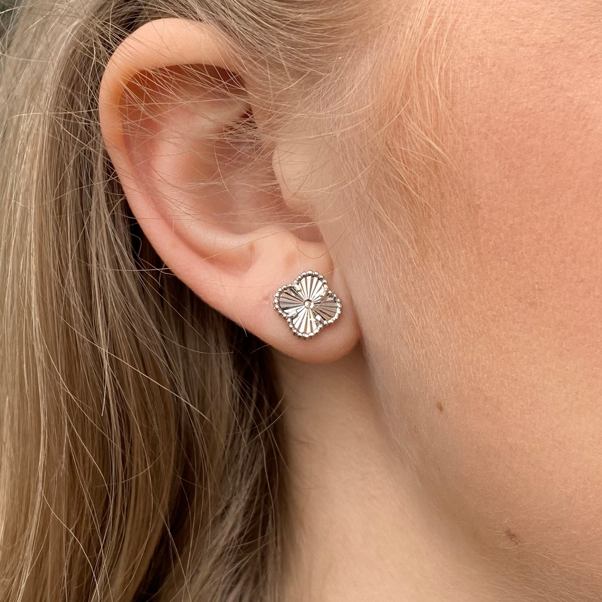 Silver quatrefoil earring and necklace set by Insignia featuring elegant matching jewelry with intricate designs.