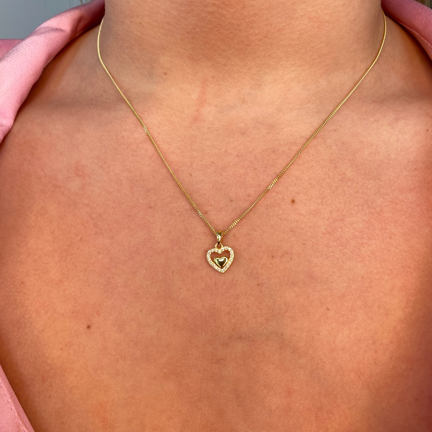 Insignia Sunshine CZ heart earring and necklace set featuring sparkling heart-shaped jewelry with yellow accents and gold-tone finish.