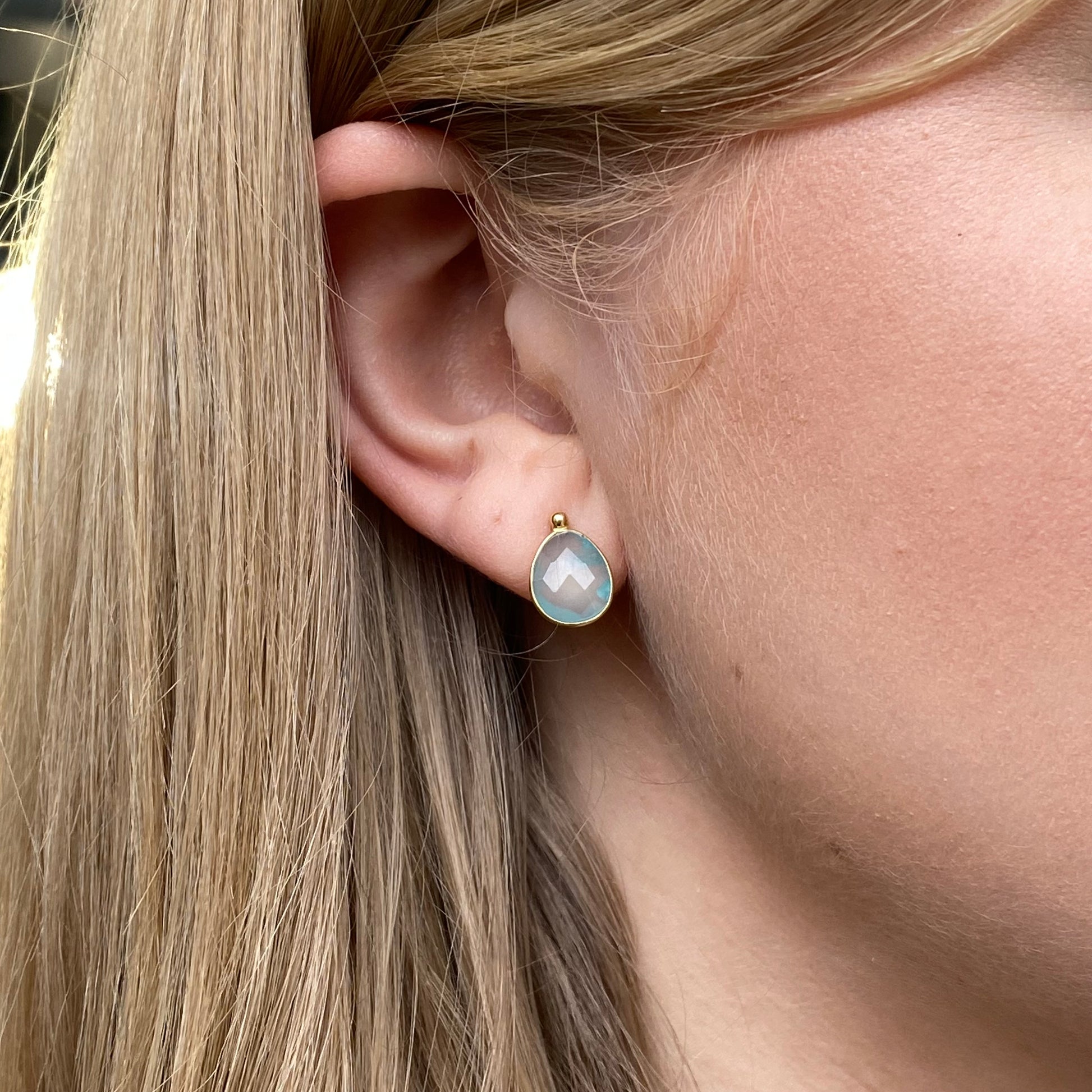 Bruno 18ct gold pear-shaped chalcedony stud earrings showcasing smooth, polished gemstones on gold posts.