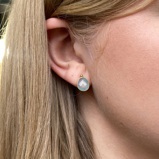 Bruno 18ct gold pear-shaped chalcedony stud earrings showcasing smooth, polished gemstones on gold posts.