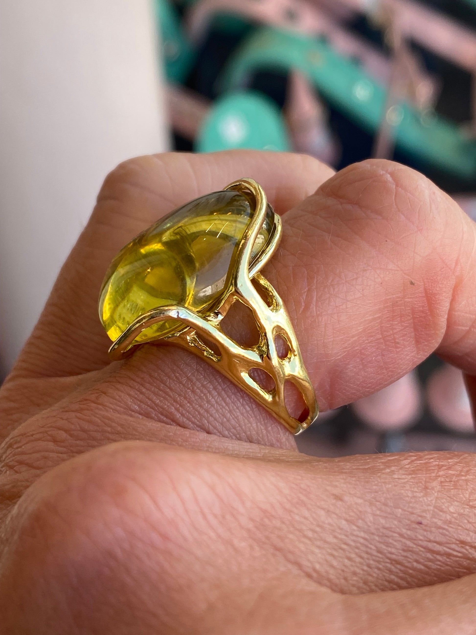 Bruno Lime Amber Nugget Ring featuring a polished amber gemstone set in a sleek metal band, close-up view of the ring.