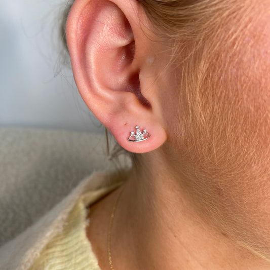 Silver CZ orb stud earrings for kids by Comero, featuring shiny round gemstone accents in a simple, elegant design.