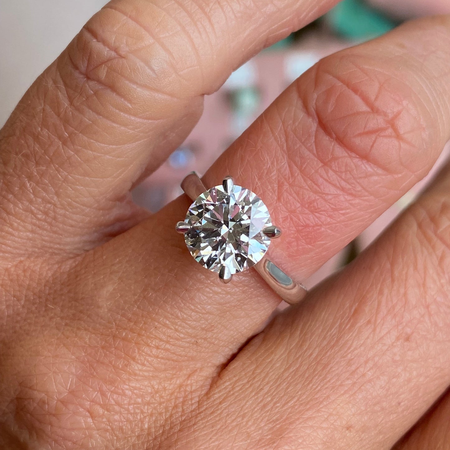 TCA platinum solitaire engagement ring featuring a 3.01ct certified lab diamond, showcasing a sleek and elegant design.
