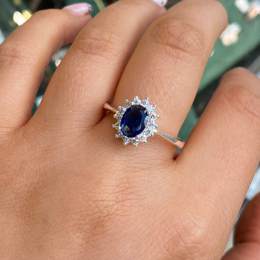 Silver Sapphire CZ Diana Ring by Kurate featuring a silver band with a central sapphire-colored cubic zirconia gemstone.