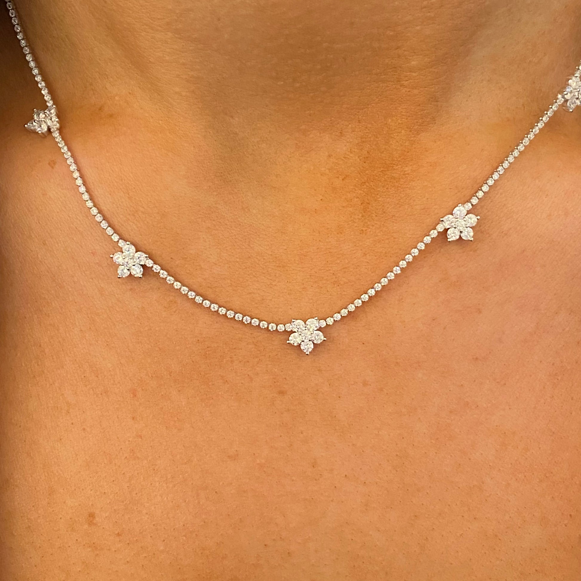 Silver floral CZ fringe necklace by Comero with 42+3cm chain, featuring intricate floral and fringe design with sparkling cubic zirconia accents.