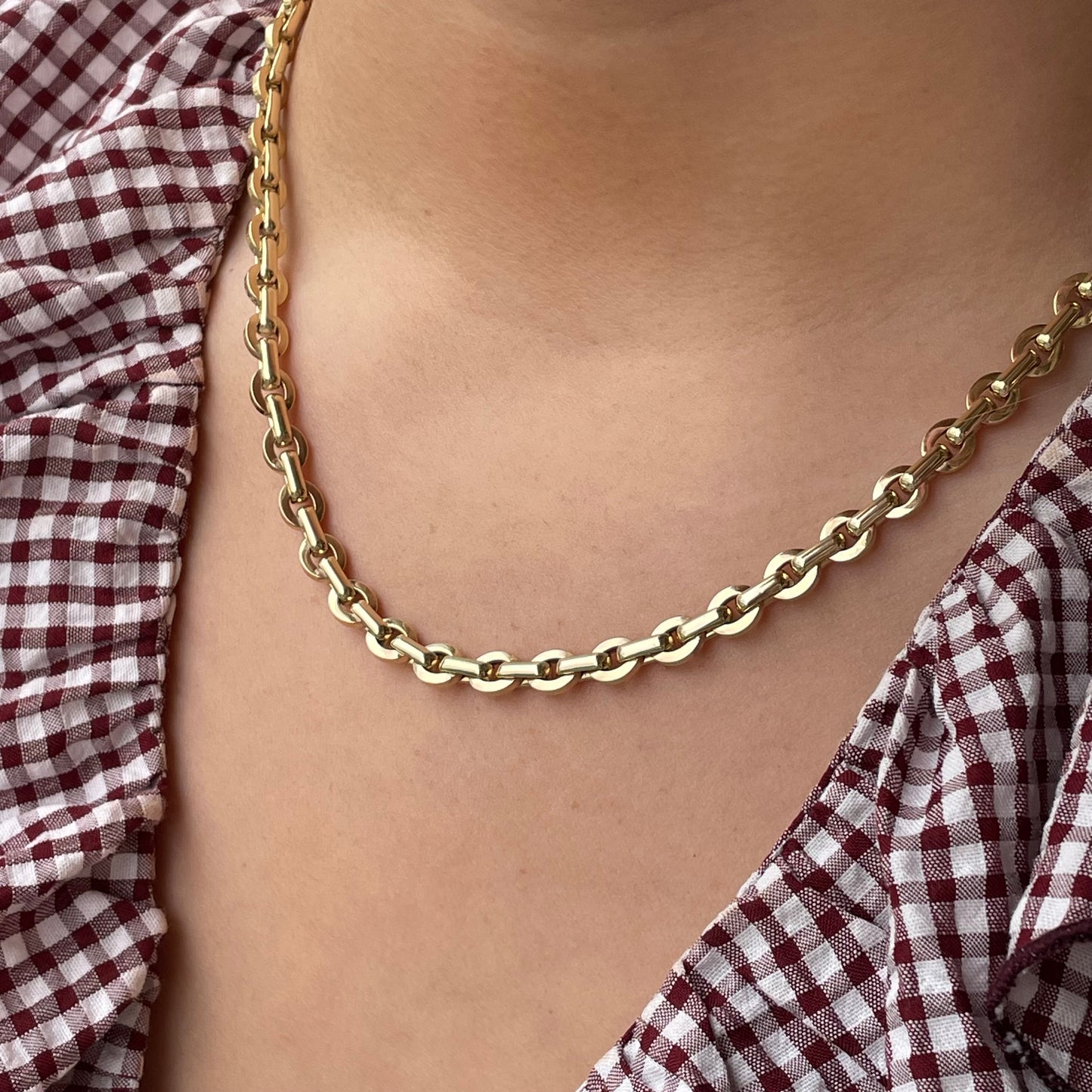 9ct gold chunky contemporary link necklace by Mark Milton, featuring bold interlocking chain links on a white background.