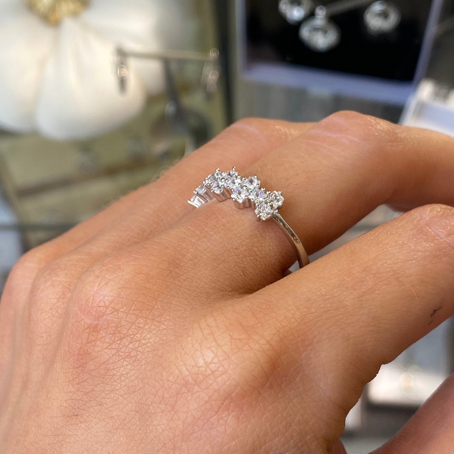 Silver Adira ring by Comero featuring a sleek band with subtle textured design on a white background.
