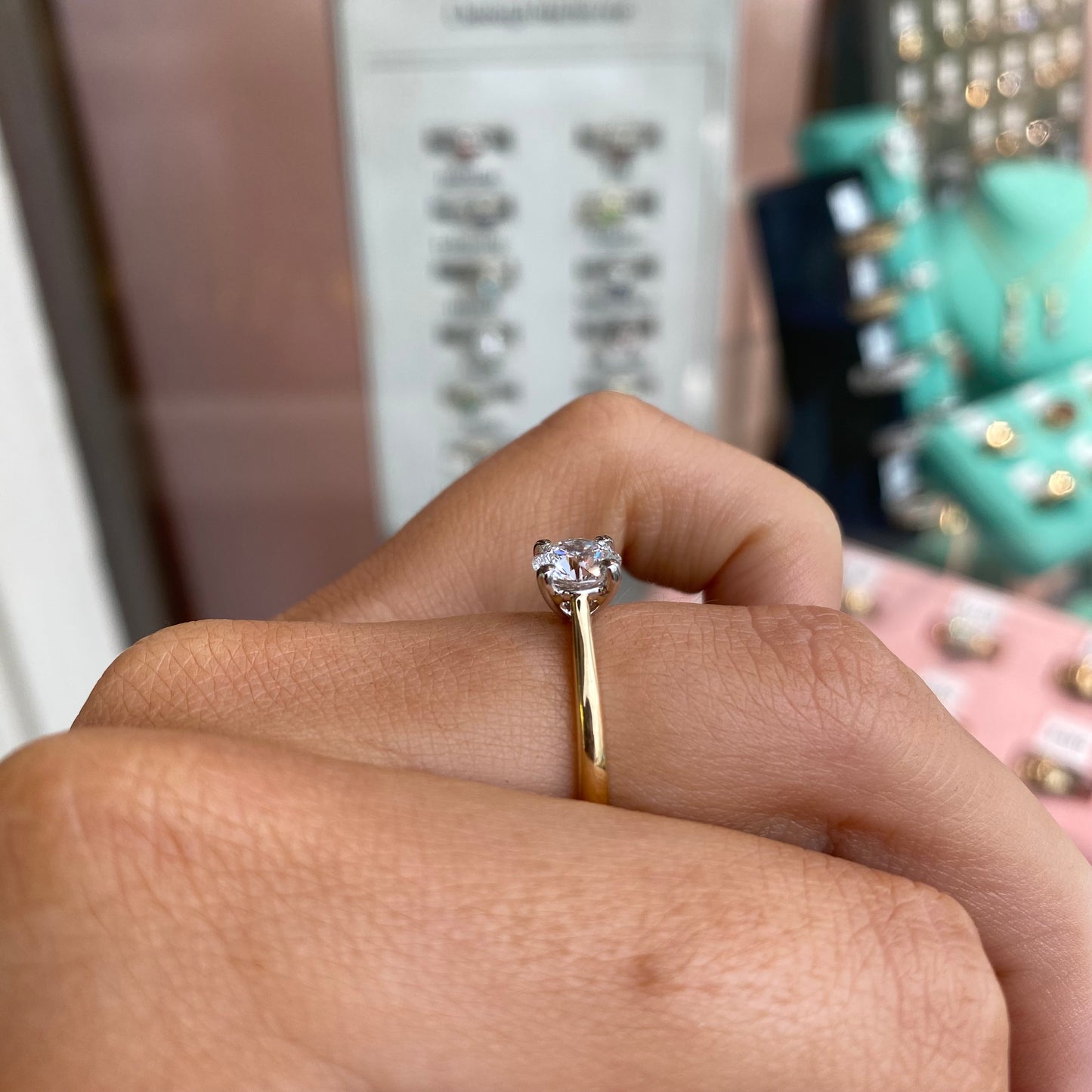 18ct gold solitaire engagement ring by Prima with a 1.01ct certified lab-grown diamond, featuring a classic and elegant design.