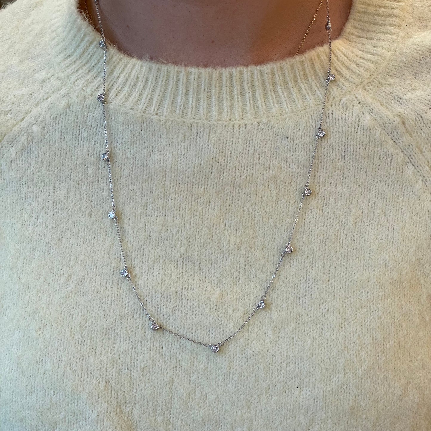Silver CZ station necklace by Comero with 60+5cm chain featuring sparkling cubic zirconia stones.
