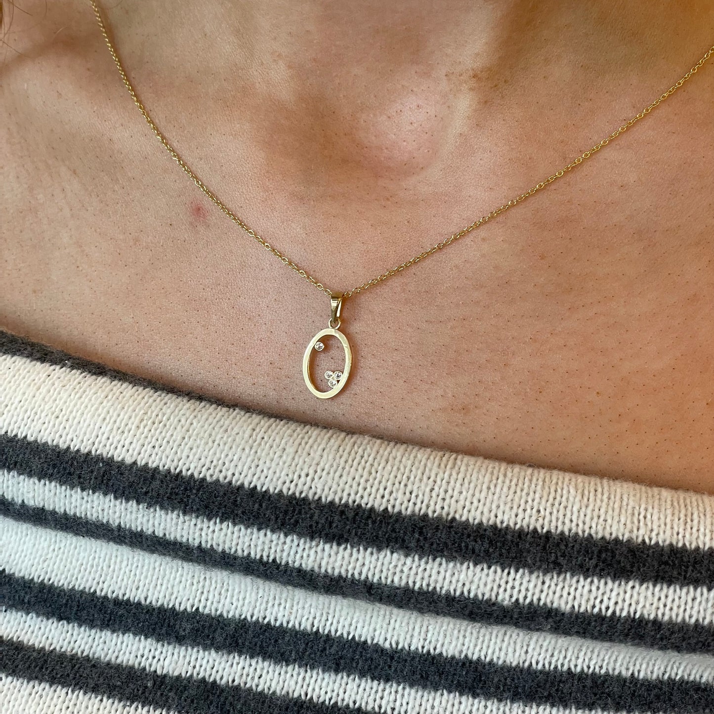 9ct gold pretty CZ open oval necklace featuring sparkling cubic zirconia for an elegant jewelry piece.