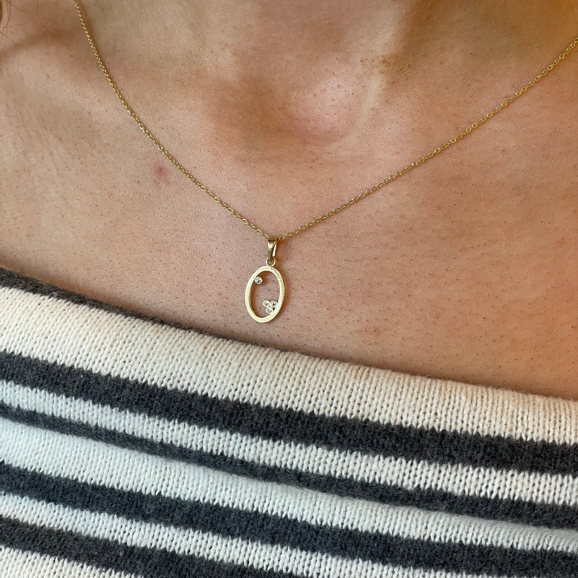 9ct gold pretty CZ open oval necklace featuring sparkling cubic zirconia for an elegant jewelry piece.