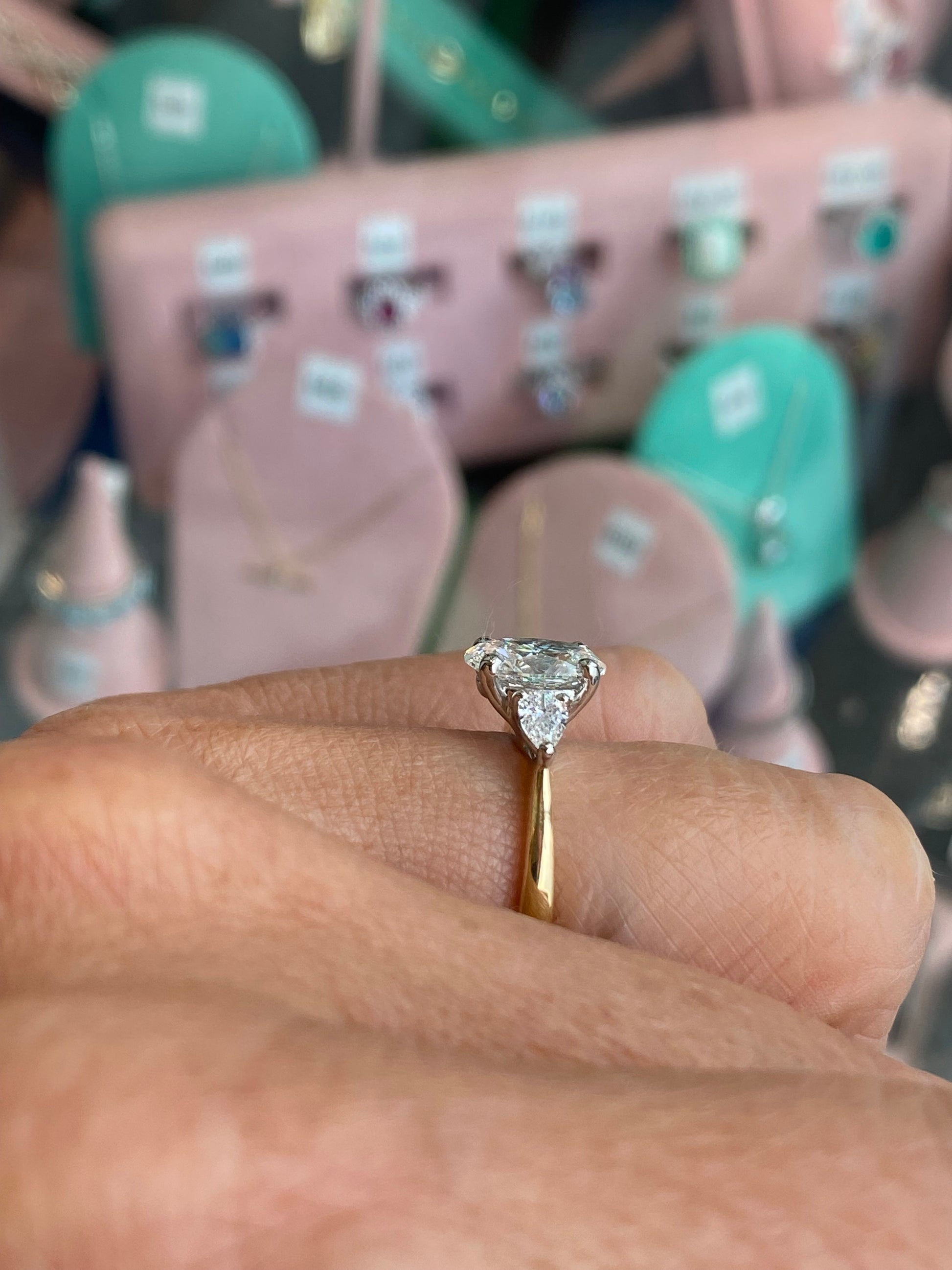 Prima 18ct gold trilogy engagement ring with a 1.84ct certificated lab diamond, featuring three sparkling stones set in a elegant band.