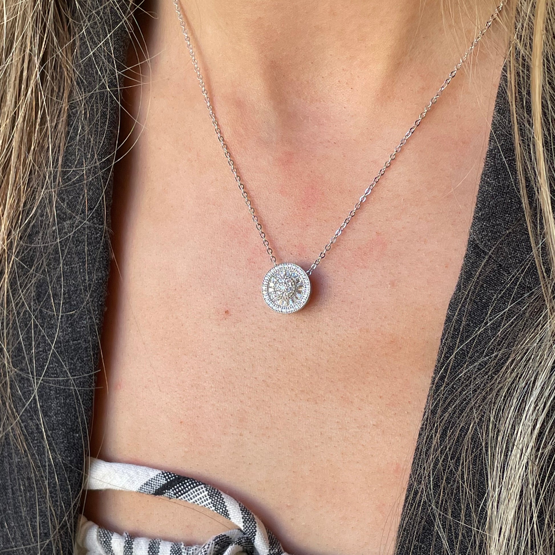 Silver CZ Halo Cluster Necklace by Comero featuring sparkling baguette and round cubic zirconia stones.