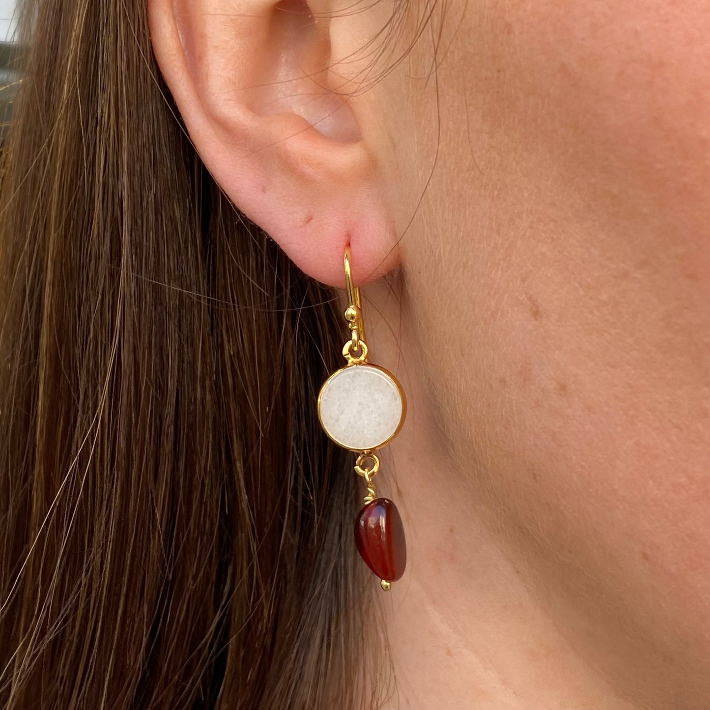 Bruno Garnet and Mother of Pearl hook drop earrings with elegant red and iridescent white stones on silver hooks.
