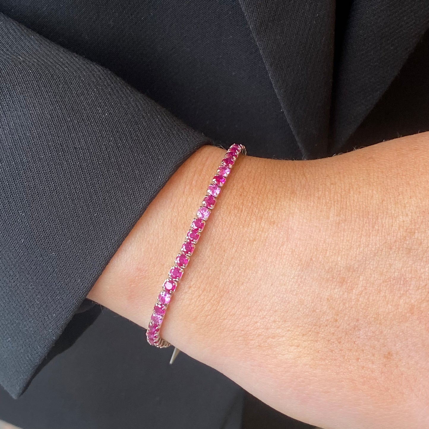 Silver Ruby Red 3mm CZ tennis bracelet by Comero, featuring sparkling red cubic zirconia stones on a sleek silver band.