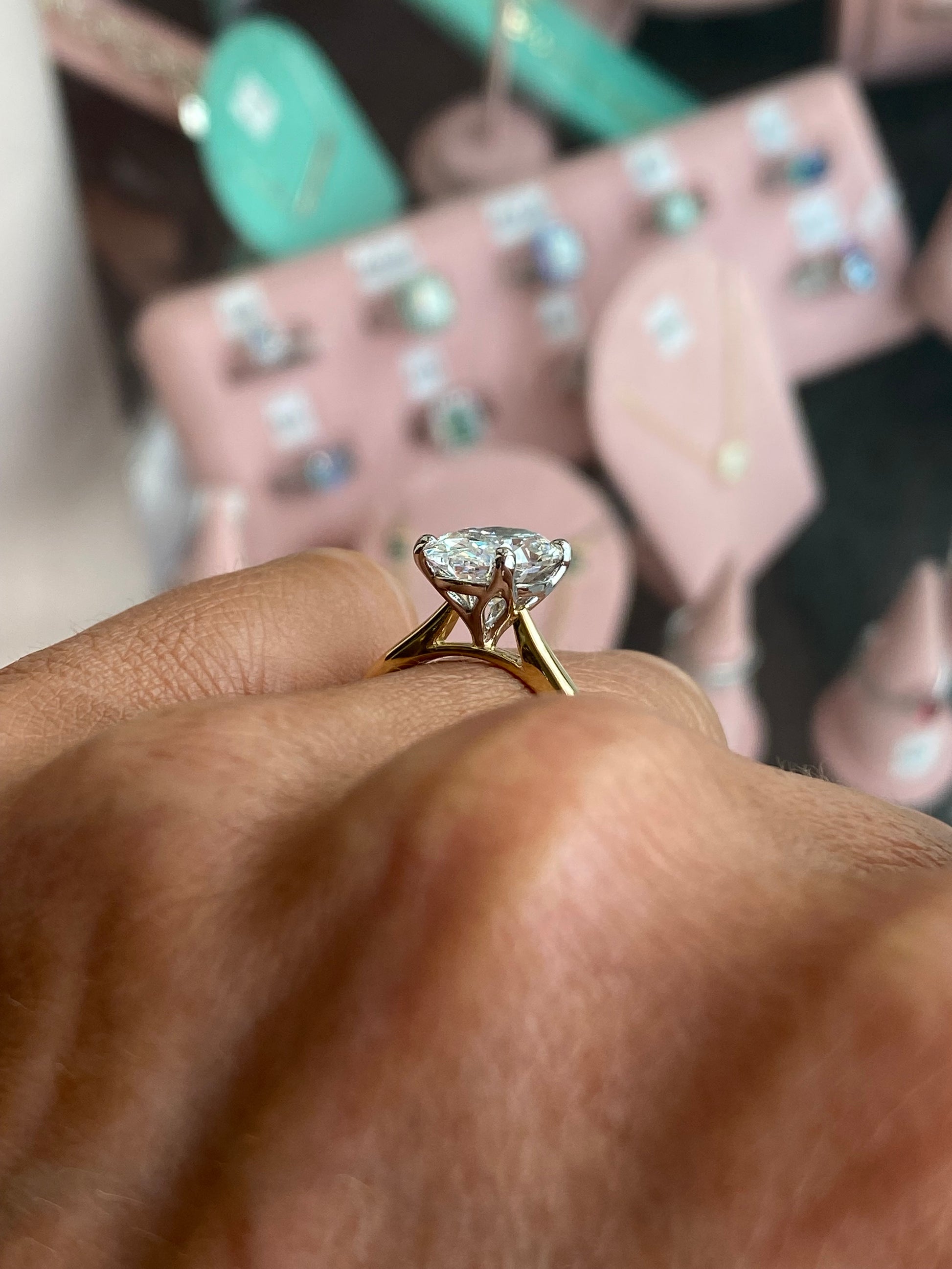 Prima 18ct gold oval solitaire engagement ring with a 3.02ct certificated diamond, featuring a sleek and elegant design.