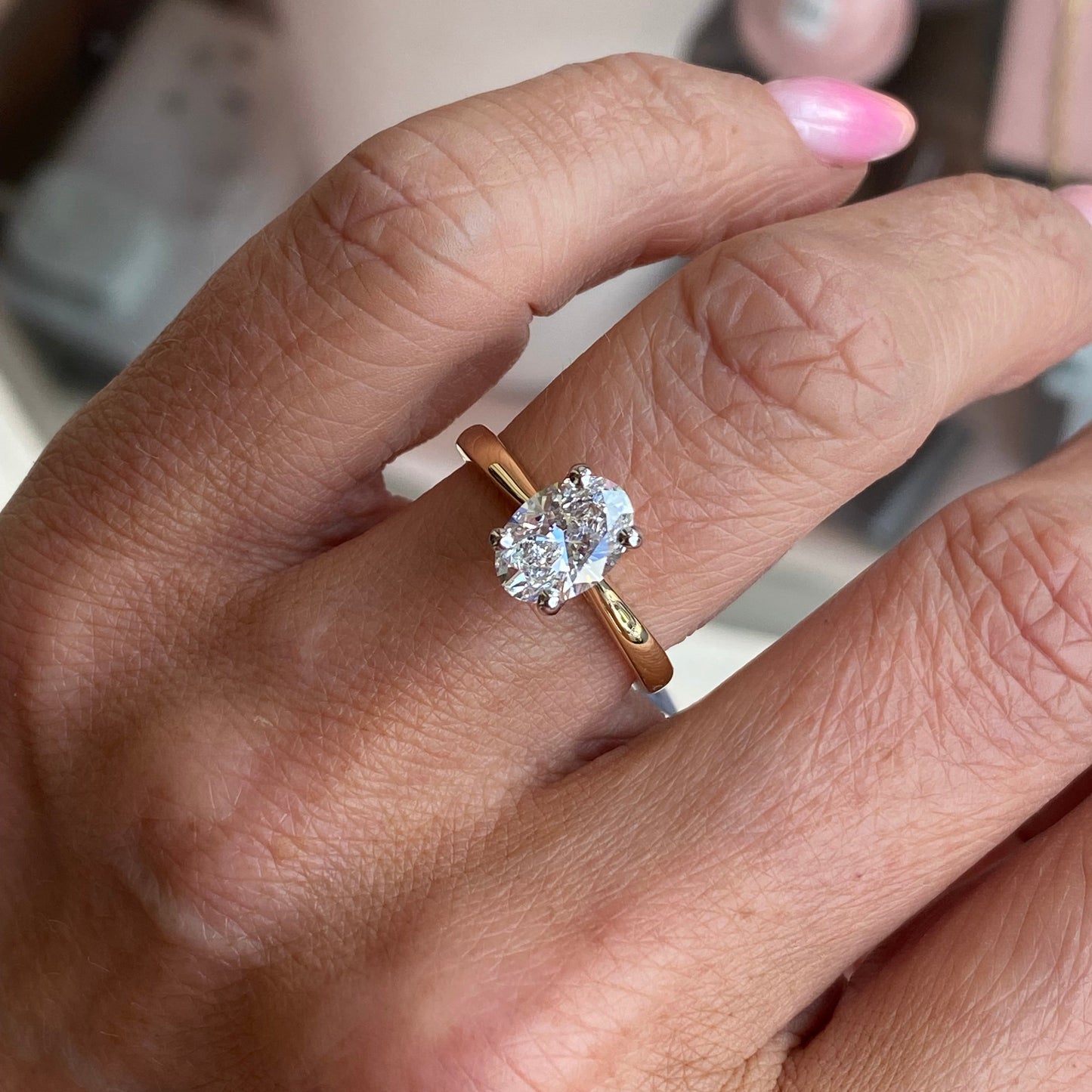 Prima 18ct gold oval solitaire engagement ring with a 1.51ct certified diamond, showcasing a sleek and elegant design.
