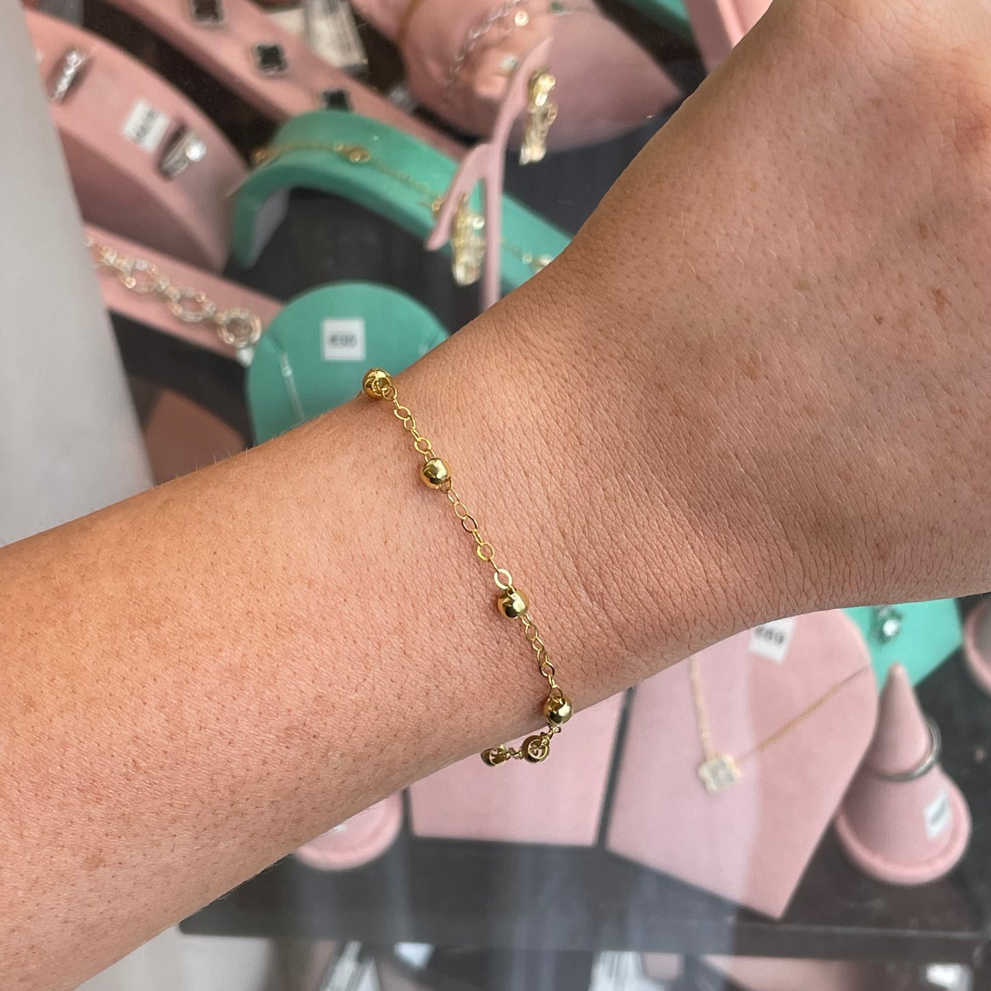 CME Sunshine Station bracelet featuring vibrant yellow beads and silver accents, stylish accessory for casual wear.