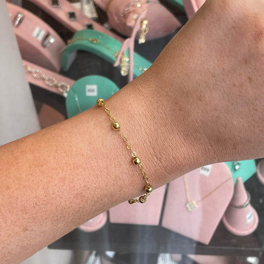 CME Sunshine Station bracelet featuring vibrant yellow beads and silver accents, stylish accessory for casual wear.