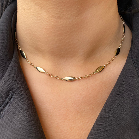 9ct gold puffed marquise necklace with delicate chain and marquise-shaped pendant, designed by NJO.