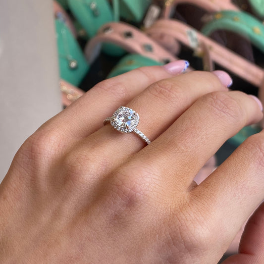 Silver cushion CZ ring by THC featuring a sparkling cubic zirconia centerpiece and a sleek, polished band.