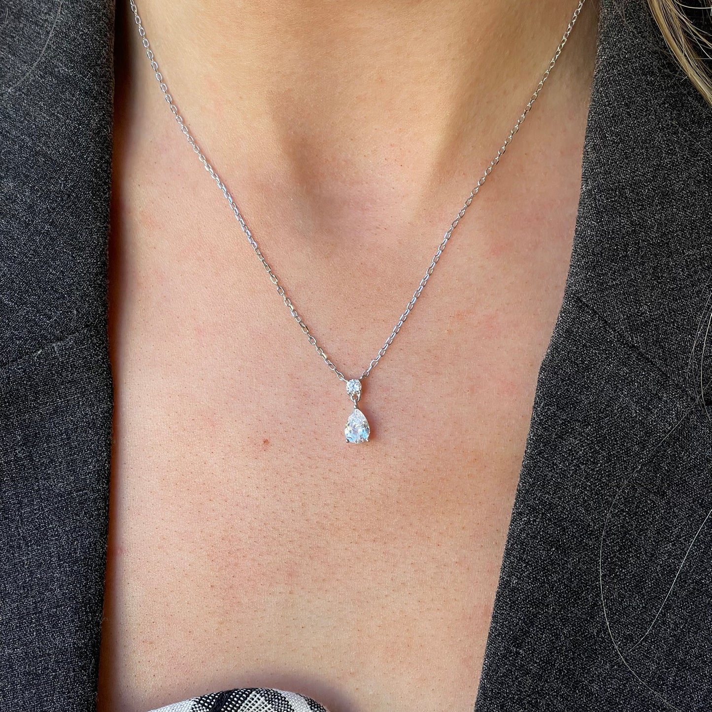 Silver Pear CZ Drop Necklace by Comero featuring a teardrop-shaped cubic zirconia pendant on a 40+5cm chain.
