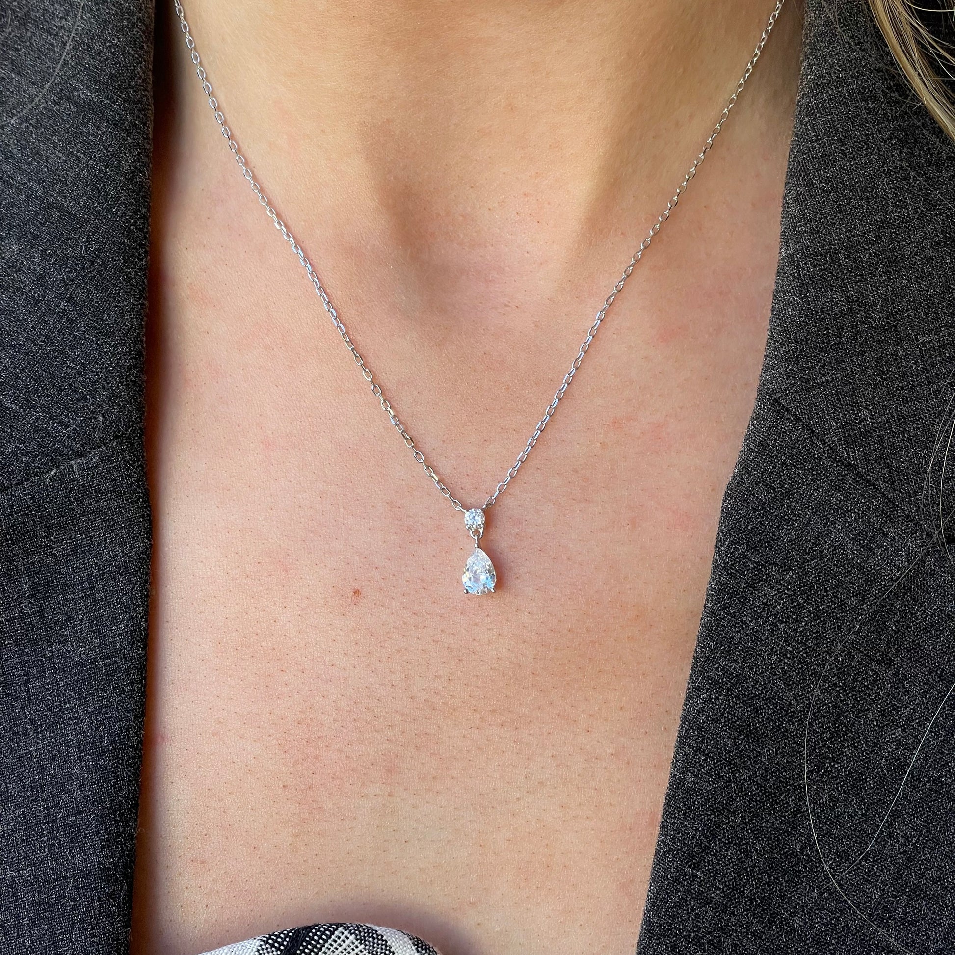 Silver Pear CZ Drop Necklace by Comero featuring a teardrop-shaped cubic zirconia pendant on a 40+5cm chain.
