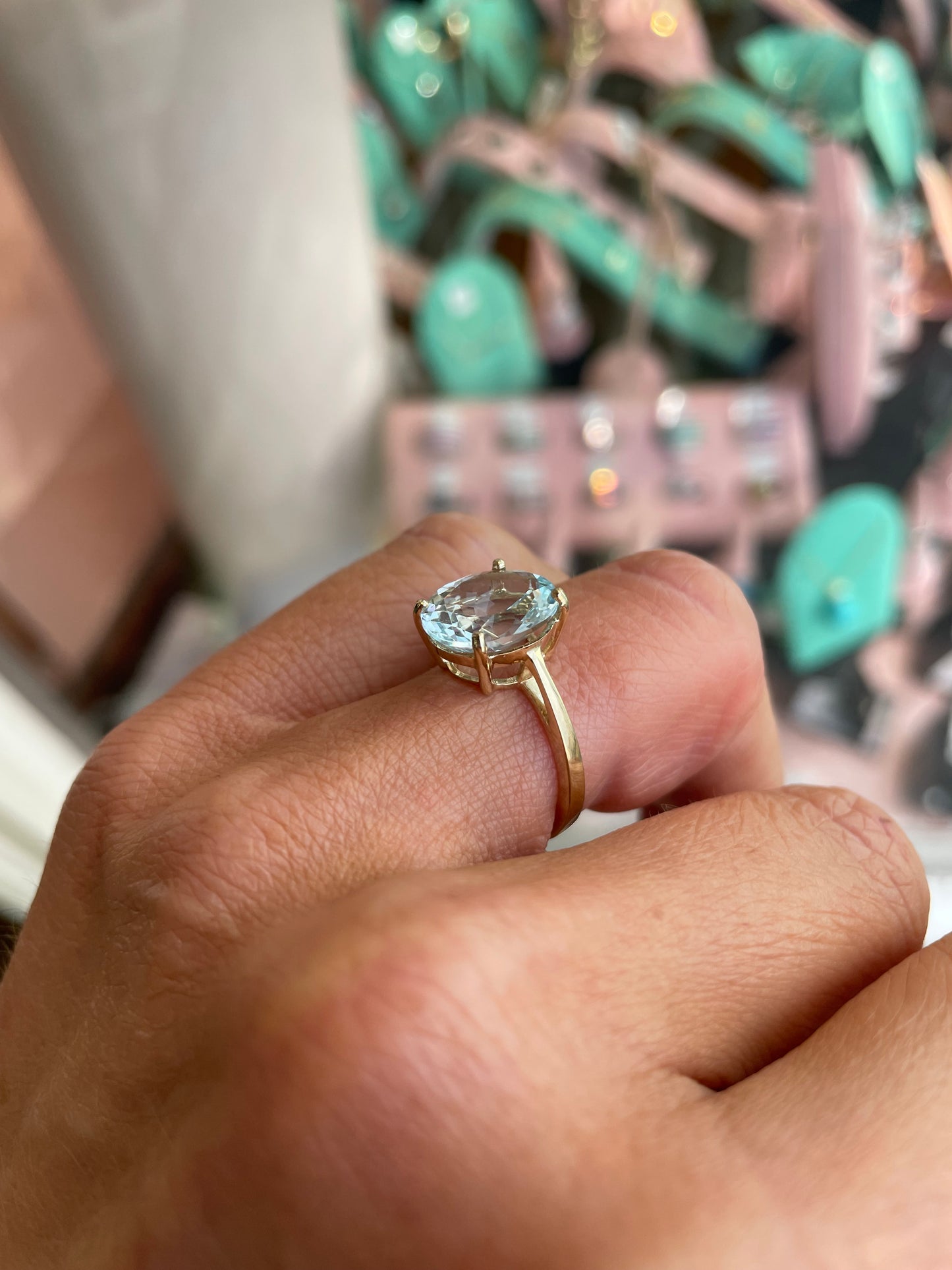 Herbert 9ct gold oval cut aquamarine ring featuring a large blue gemstone set in a classic gold band.