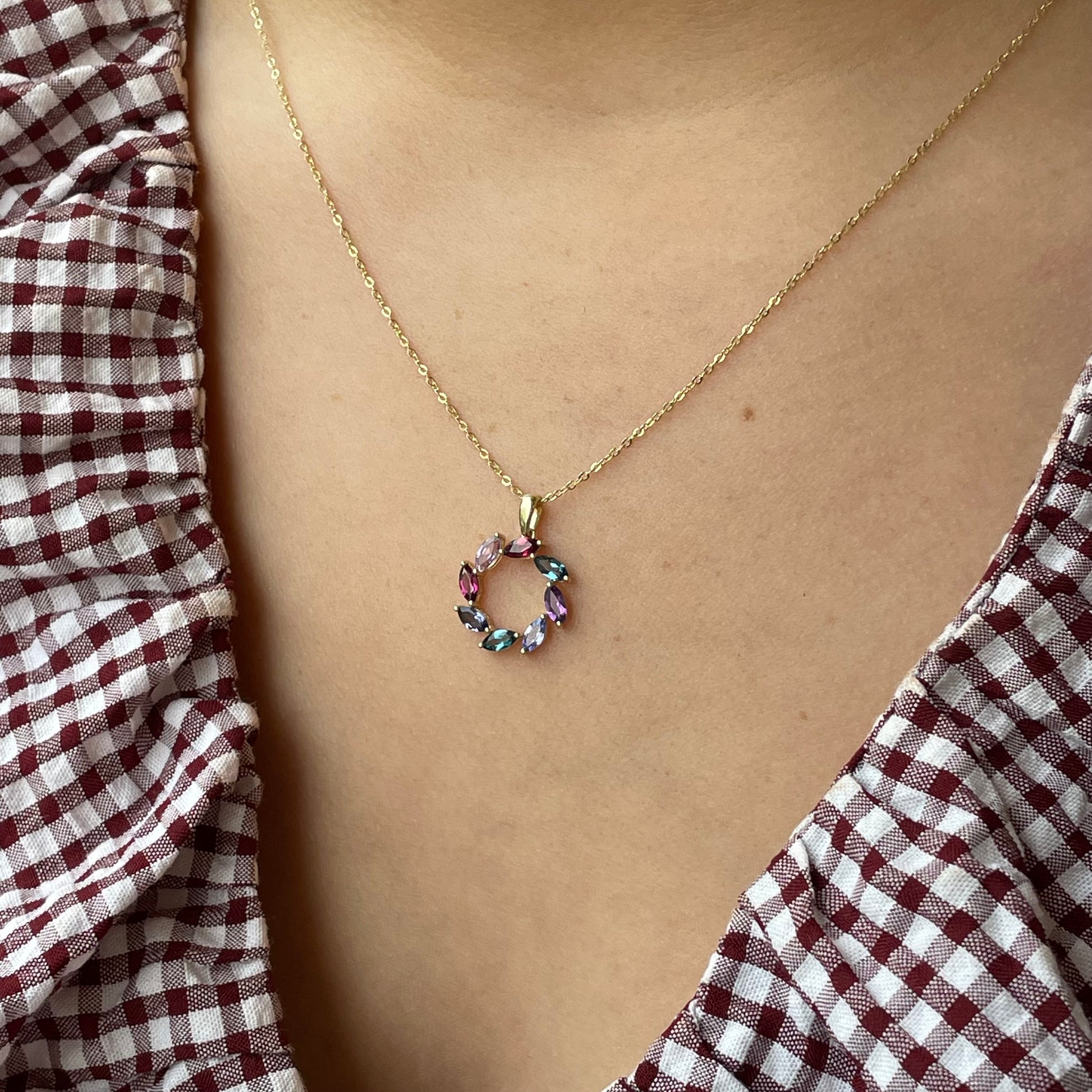 9ct gold multi-gemstone eternity necklace with colorful gemstones, featuring a delicate chain and a continuous gemstone design.