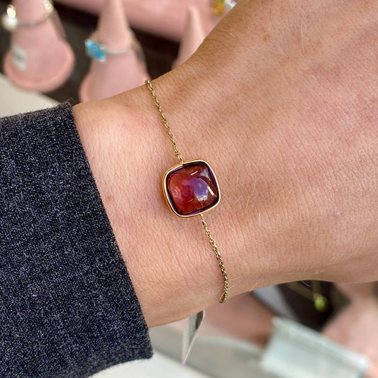 9ct gold Rhodolite garnet bracelet by Marchetti Edoardo featuring vibrant red gemstones on a delicate gold chain.